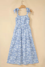 Blue floral dress on a beige background