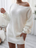 White knit sweater dress worn by a person in a neutral indoor setting