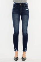 Blue jeans worn by a person on a white background