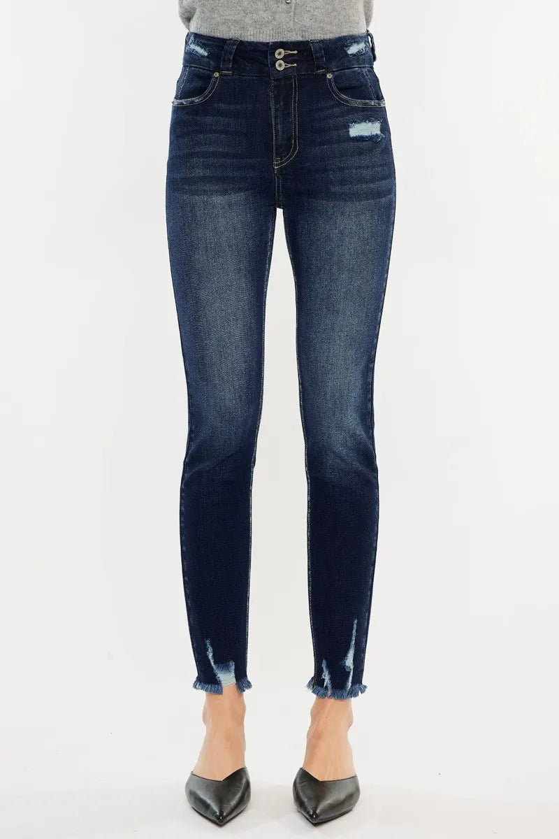 Blue jeans worn by a person on a white background