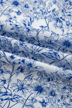 Close-up of blue floral pattern on white fabric
