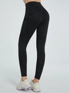 Black leggings worn by a person on a white background