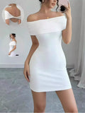 Woman wearing a white off-shoulder dress in a minimalistic setting.