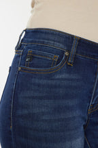 Close-up of blue jeans with a plain background