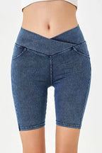 Blue denim shorts on a white background