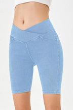 Light blue denim shorts on a white background