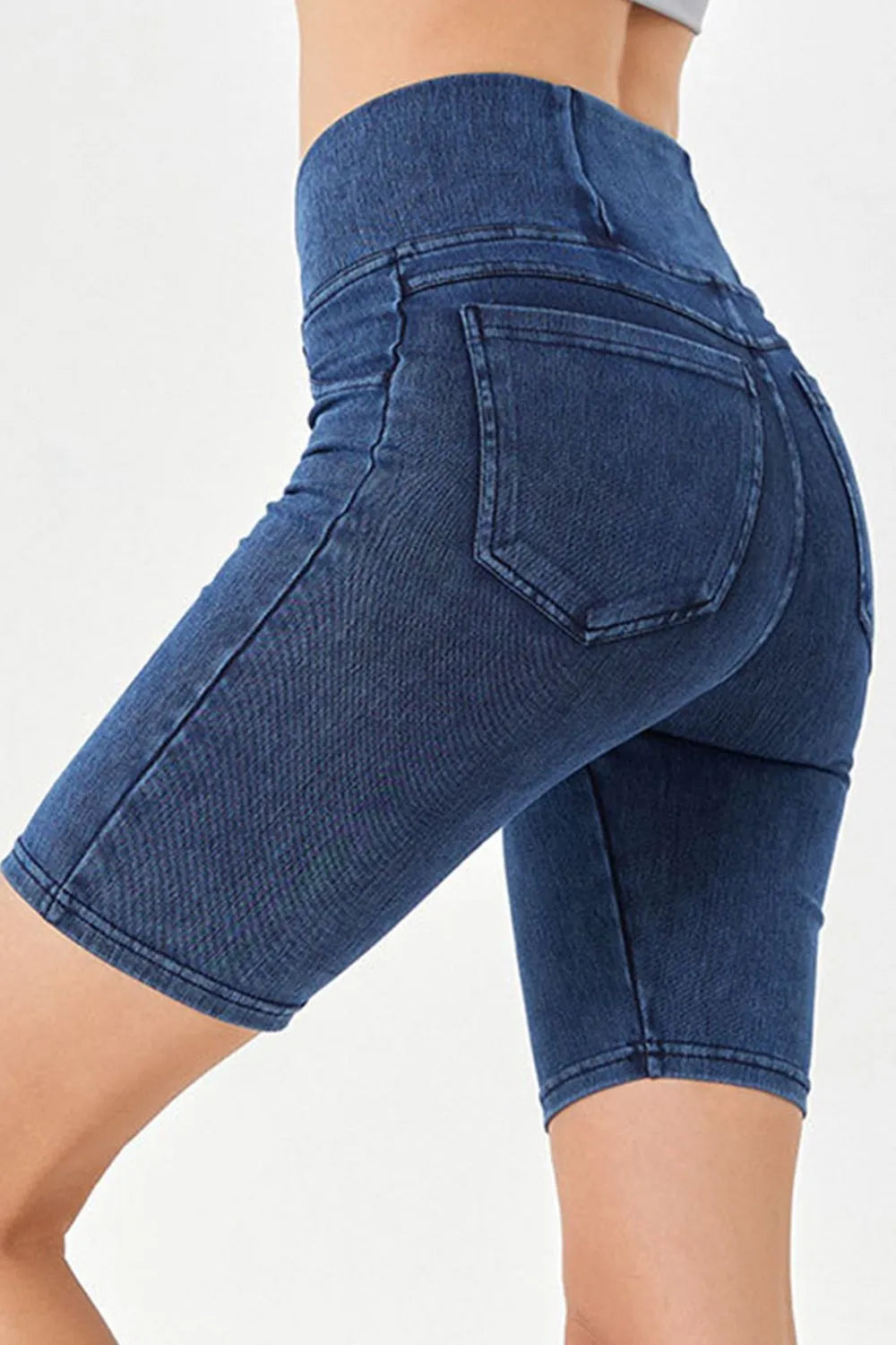 Blue denim shorts on a white background
