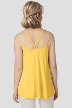 Yellow sleeveless top worn by a person on a plain background