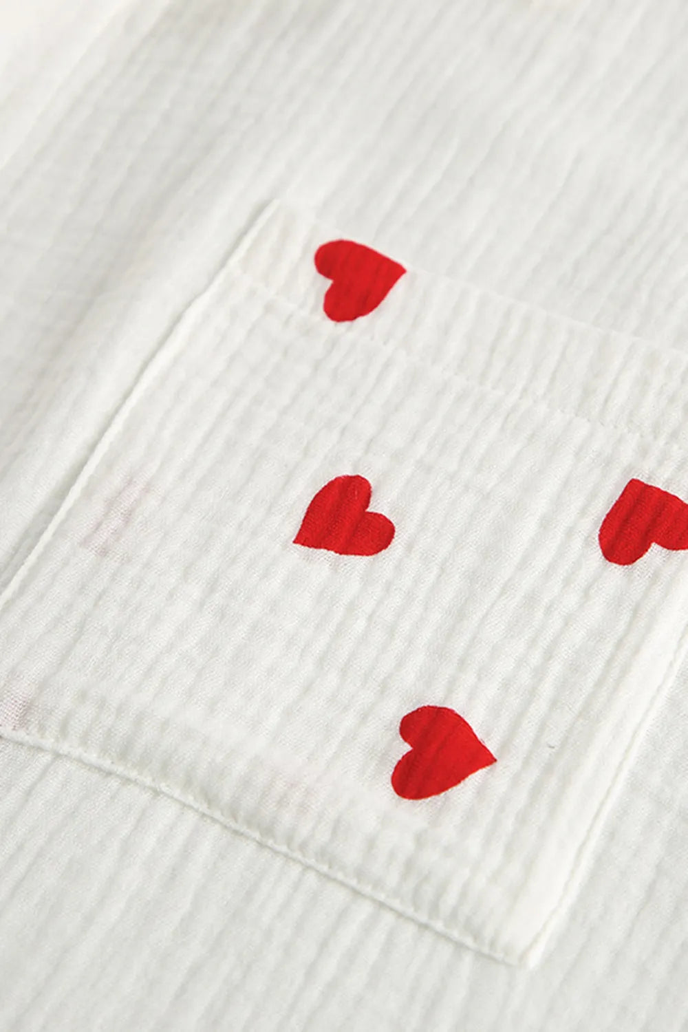 White fabric with red heart patterns