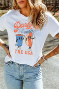 Person wearing a white t-shirt with a colorful graphic design and text.