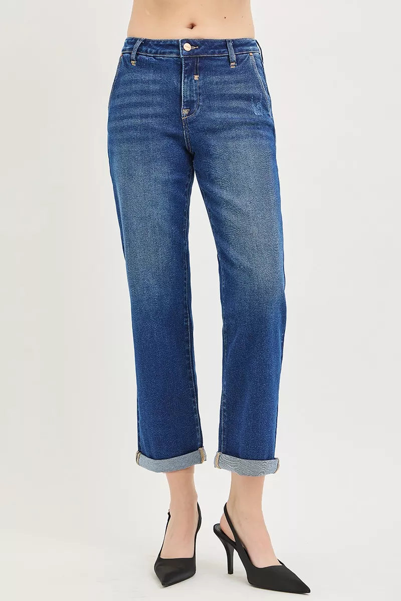 Blue jeans worn by a person on a white background