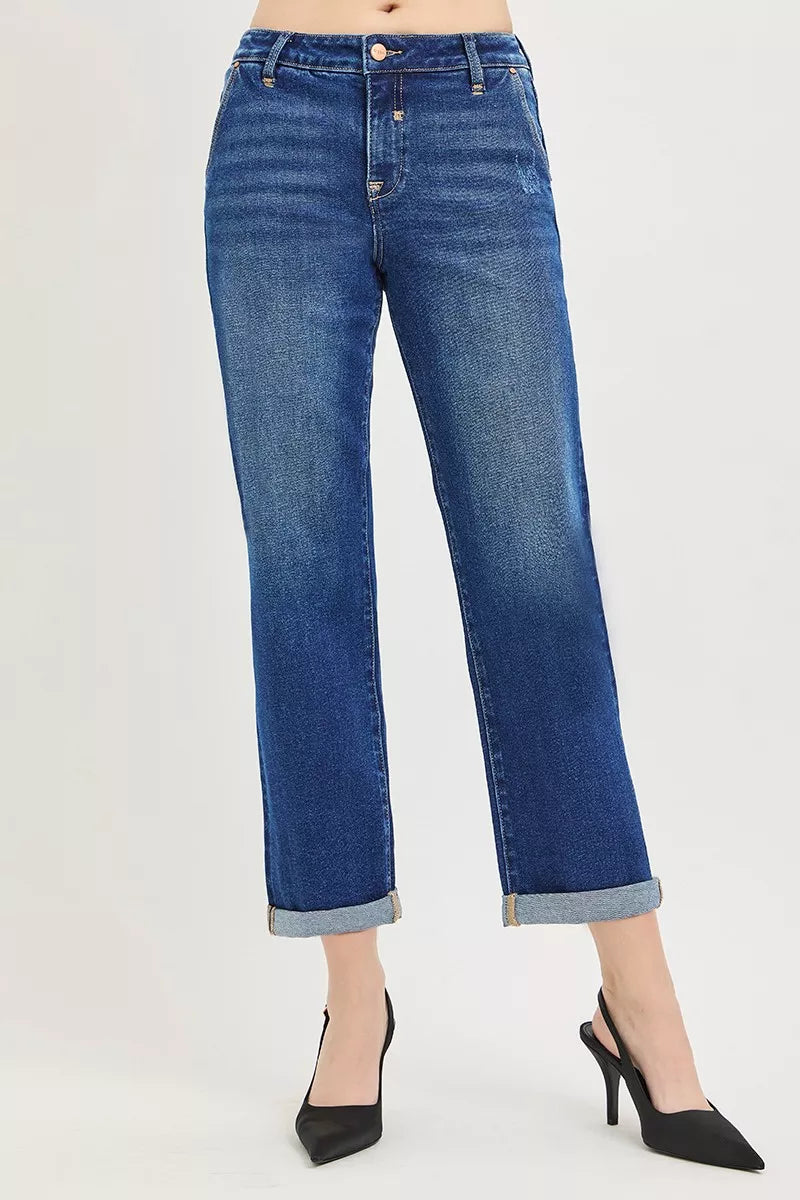 Blue jeans worn by a person on a white background