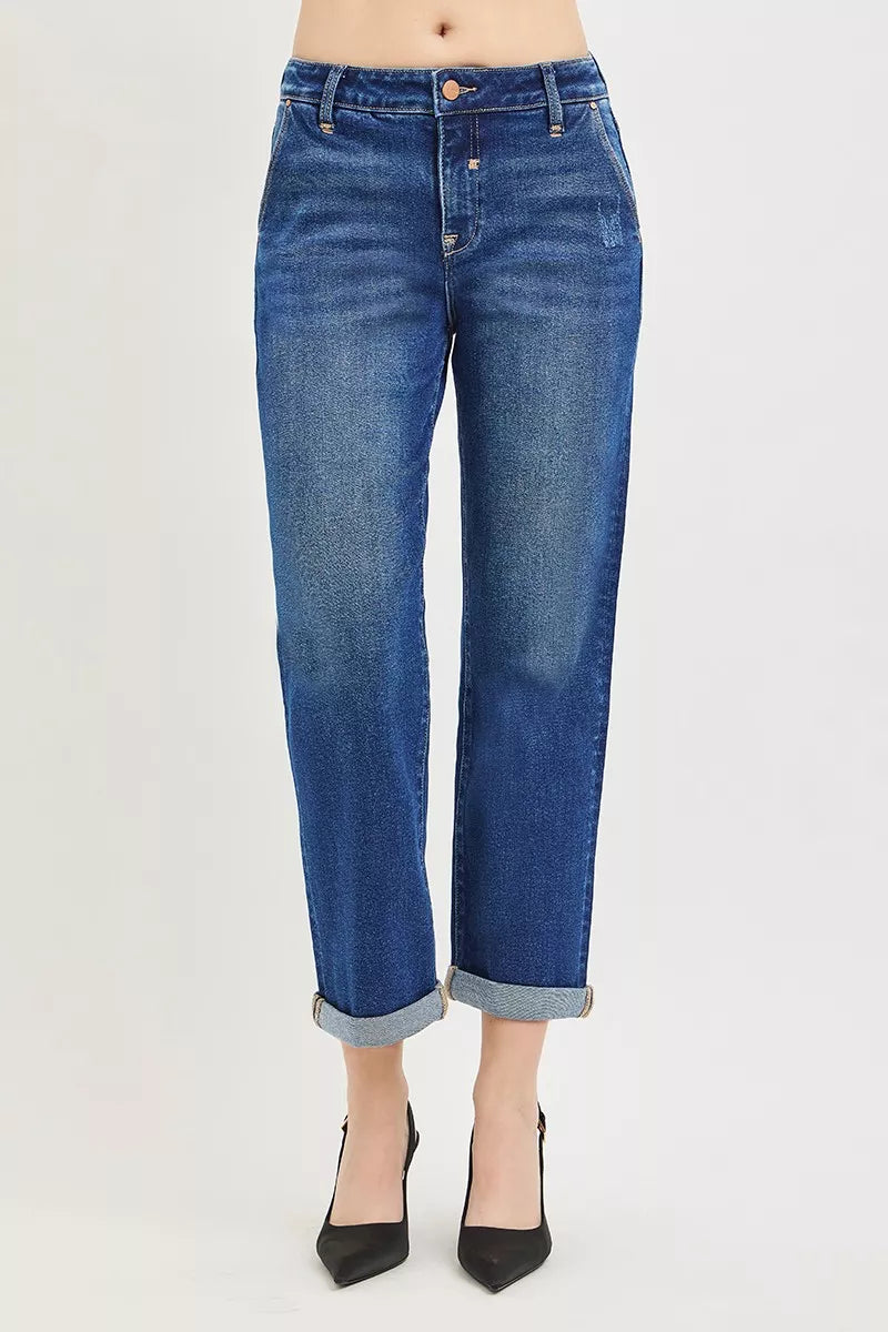 Blue jeans worn by a person on a white background