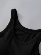 Close-up of a black tank top on a light gray background