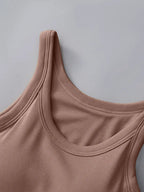 Close-up of a pink tank top against a gray background