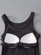 Black tank top with white bra cups on a gray background
