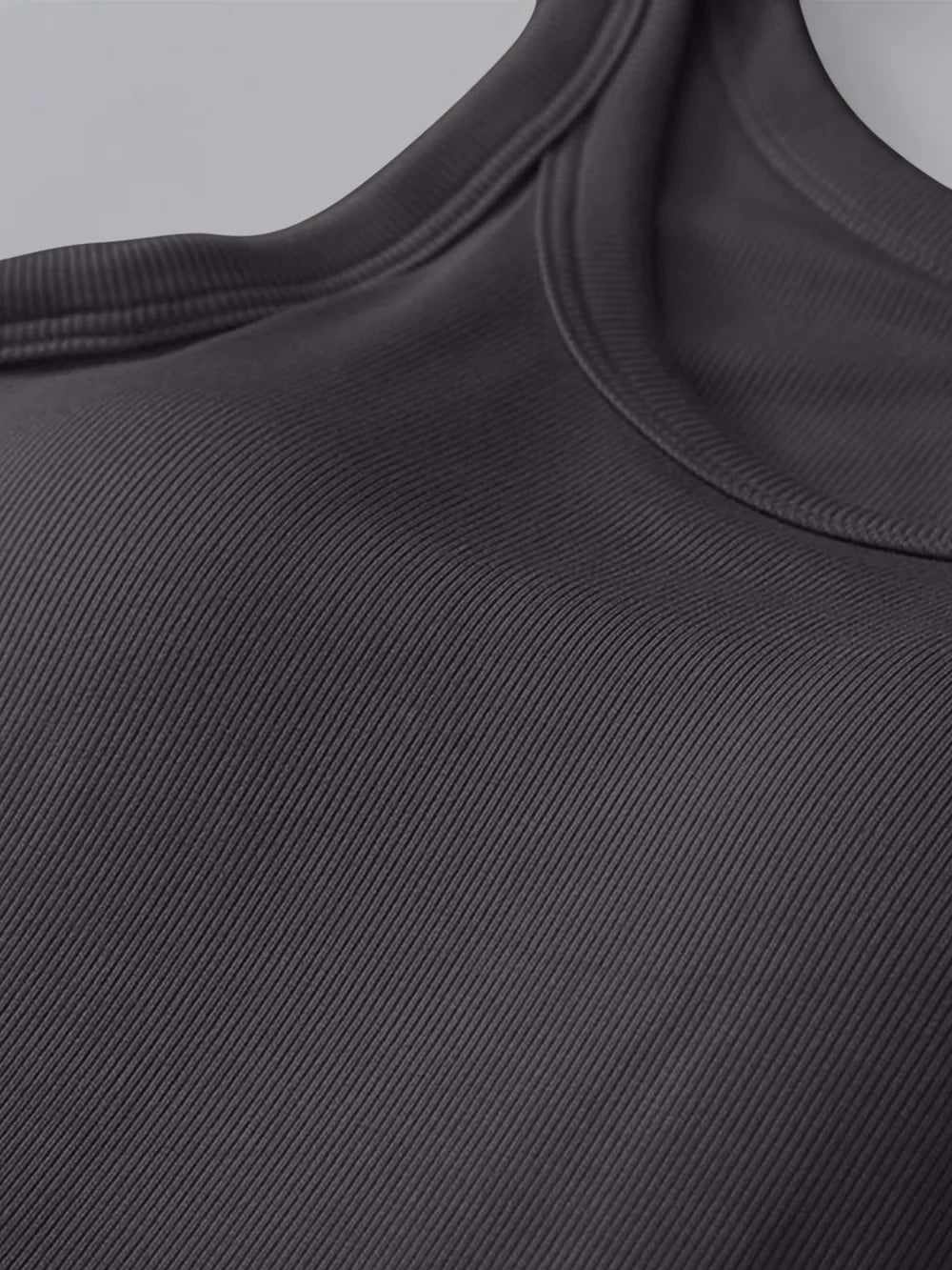 Close-up of a dark gray sleeveless top with a ribbed texture.