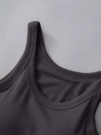 Close-up of a dark gray tank top on a light gray background