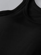 Close-up of a black sleeveless top with a plain background