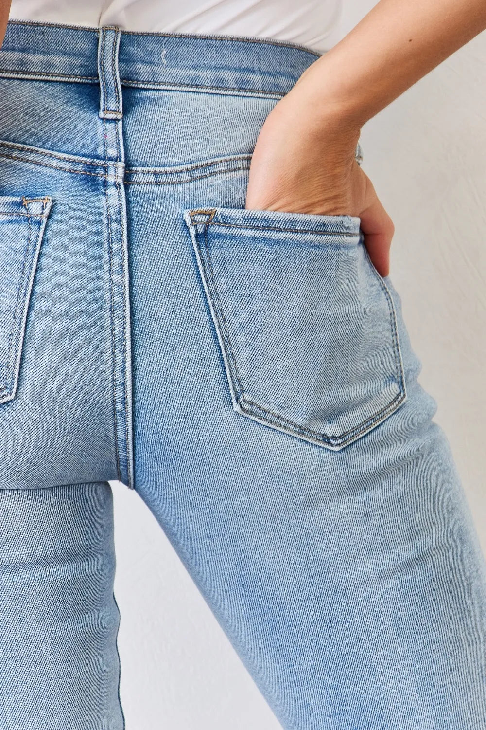 Light blue jeans with a neutral background
