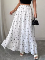 Person wearing a white floral skirt with a plain background