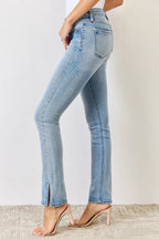 Light blue jeans worn by a person on a neutral background