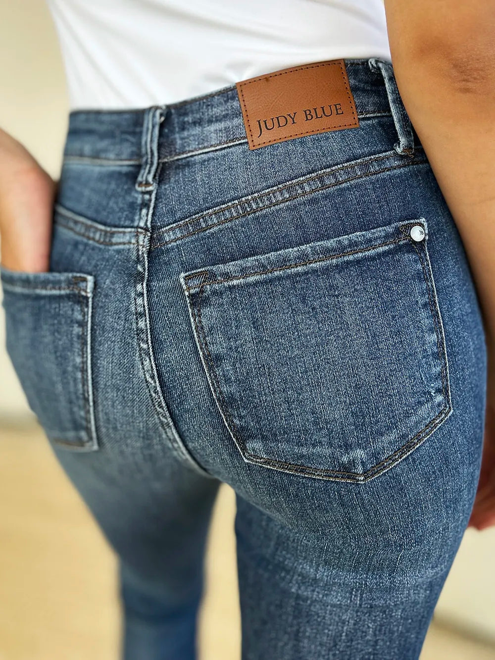 Close-up of blue jeans with a Judy Blue label on a blurred background